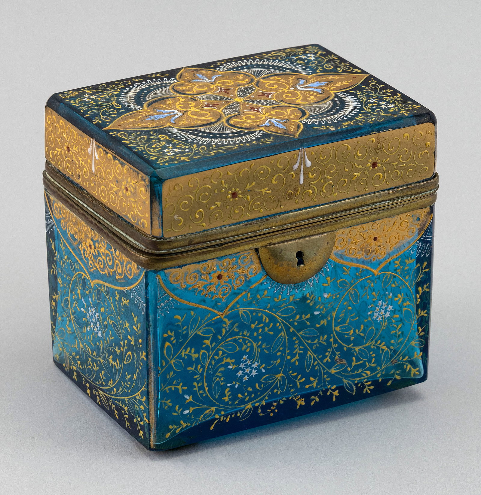 FINE BOHEMIAN ENAMELED BLUE GLASS DRESSER OR JEWELRY BOX ATTRIBUTED TO MOSER 19th Century Height: FINE BOHEMIAN ENAMELED BLUE GLASS DRESSER OR JEWELRY BOX ATTRIBUTED TO MOSER19th CenturyLikely made for the Turkish or Islamic market. Raised Orientalist decoration. Brass mounts and lock plate (no ke