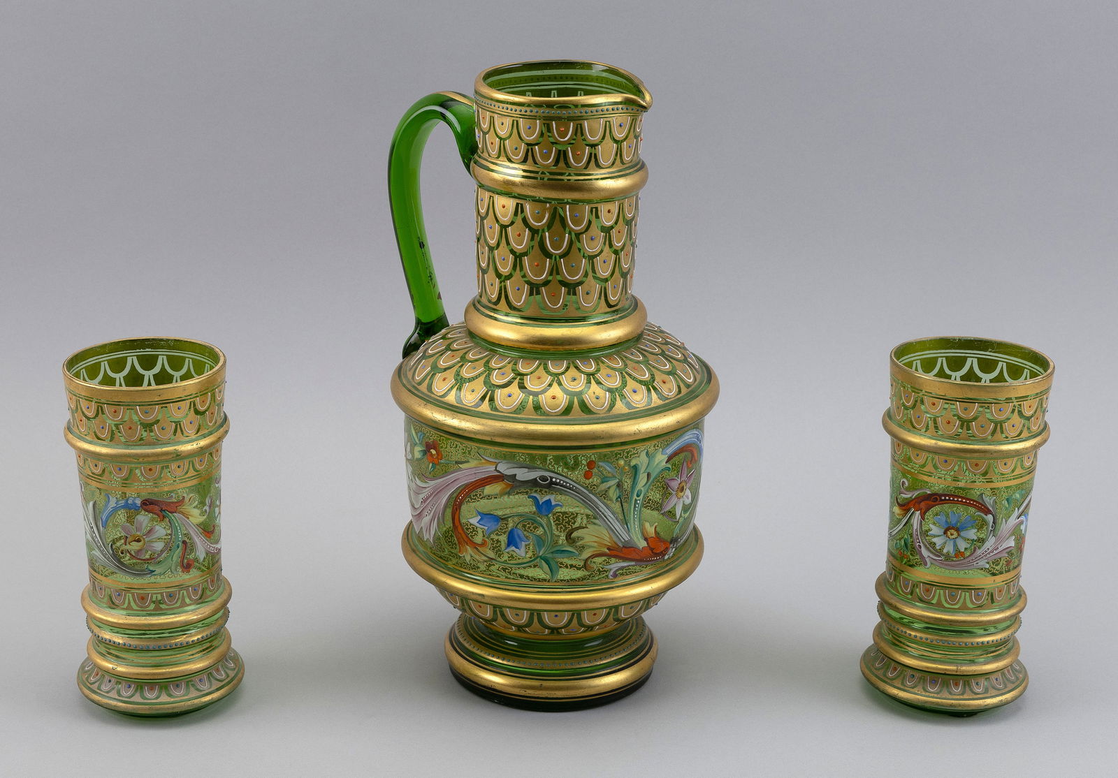BOHEMIAN THREE-PIECE ENAMELED GREEN GLASS DRINKING SET 19th Century Pitcher height 12". Cup heights (1 of 4)