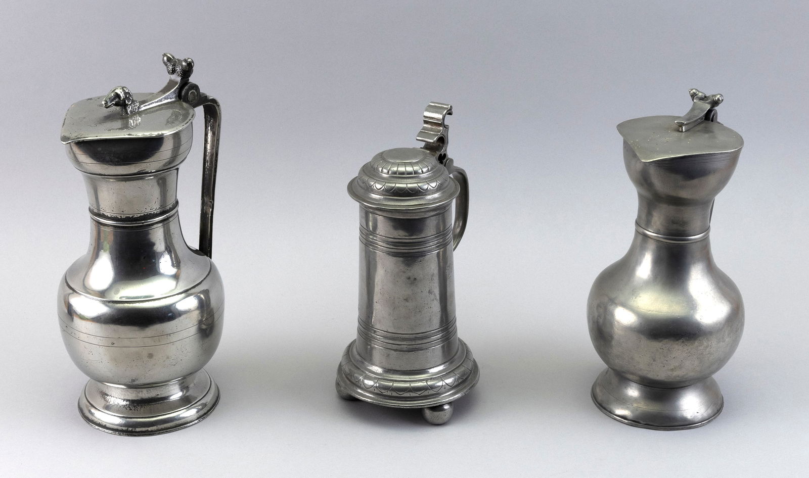 THREE CONTINENTAL PEWTER FLAGONS 18th/Early 19th Century Heights from 10.25" to 12". (1 of 4)