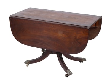 CLASSICAL MAHOGANY DROP-LEAF TABLE 19th Century Height 29". Length 21" plus two 15" drop leaves.