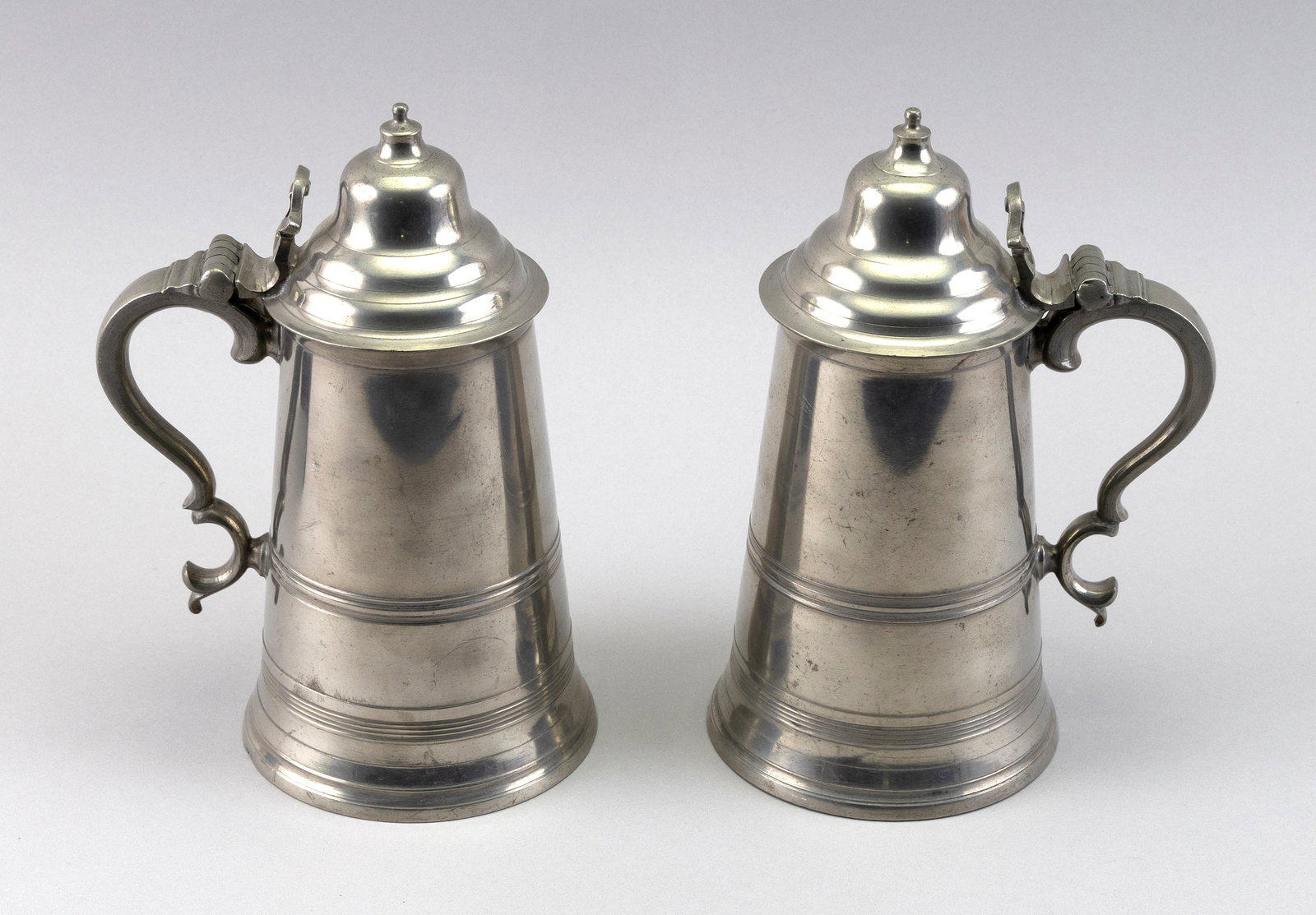 PAIR OF ROBERT BUSH II PEWTER FLAGONS Bristol, England, Late 18th/Early 19th Century Heights 9.25". (1 of 7)