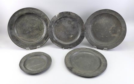 FIVE PEWTER PLATES AND CHARGERS 18th/19th Century Diameters from 11" to 17".