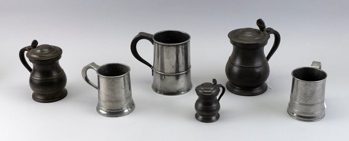 SIX PEWTER DRINKING VESSELS First Half of the 19th Century Heights from 4" to 8".