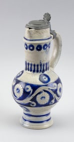 GERMAN POTTERY PITCHER WITH BLUE FLORAL DECORATION 19th Century Height 10.5".
