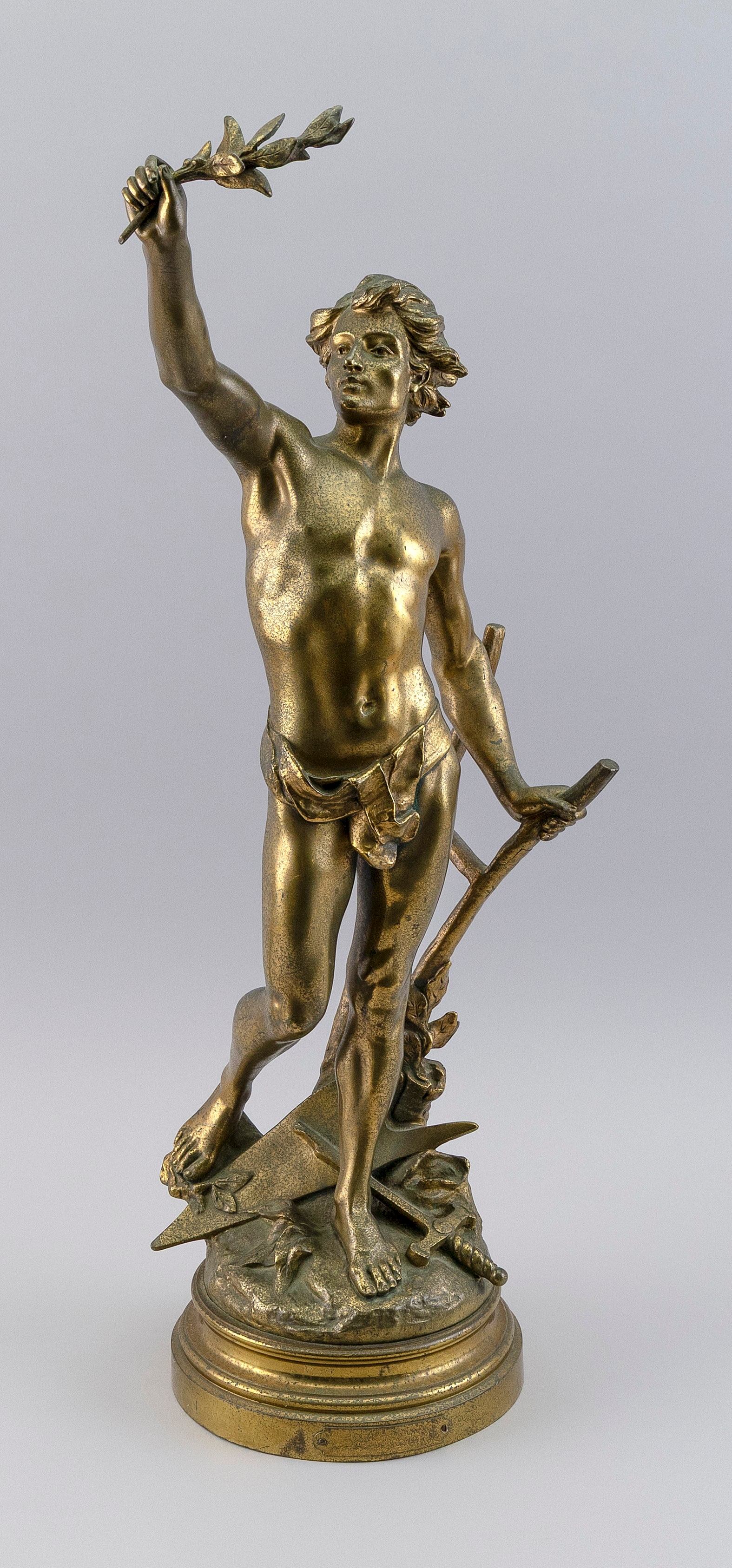 EDOUARD DROUOT (France, 1859-1945), "Pax Labor", a heroic young man with an olive branch and a: EDOUARD DROUOTFrance, 1859-1945"Pax Labor", a heroic young man with an olive branch and a plow. Signed on rockery base "E. Drouot". Titled on plaque on base "Par E. Drouot (Salon des Beaux-Arts)".Gilt
