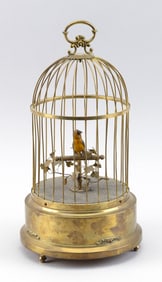 SINGING BIRD AUTOMATON IN A GILDED CAGE Germany, Early 20th Century Height 12.5".