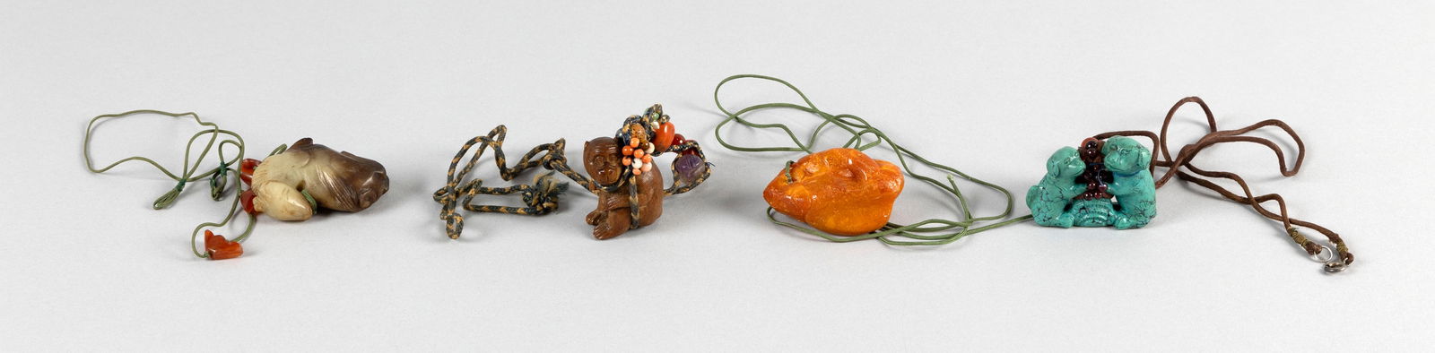 FOUR ASIAN NETSUKE/CARVINGS 20th Century Lengths from 1.5" to 2". (1 of 2)