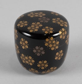 JAPANESE BLACK AND GILT LACQUER NATSUME Meiji Period Height 2". Diameter 2". With silk brocade bag.