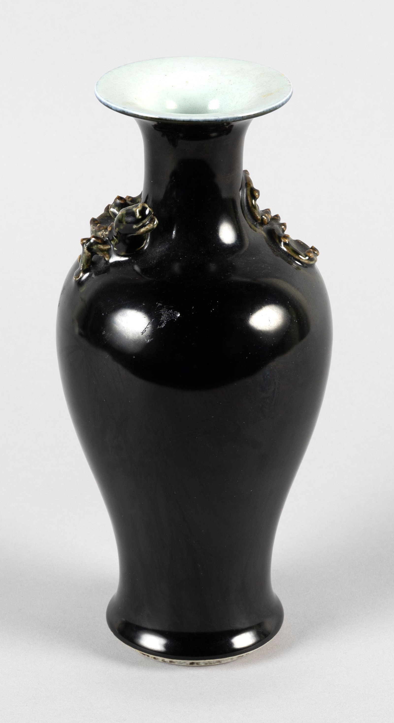 CHINESE MIRROR BLACK PORCELAIN BALUSTER VASE 19th Century Height 10".: CHINESE MIRROR BLACK PORCELAIN BALUSTER VASE 19th Century Applied kylin wraps around the shoulder. Slightly raised unglazed foot. Artemesia leaf mark on base. Height 10".