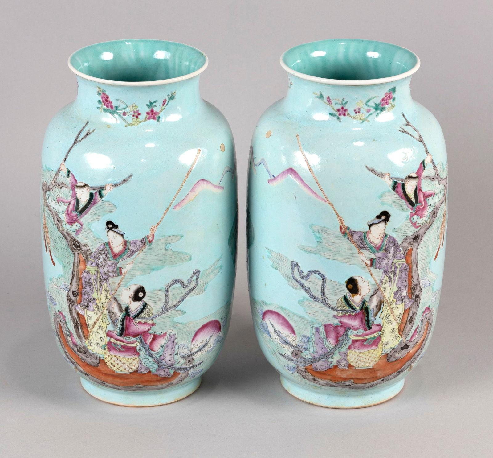 PAIR OF CHINESE FAMILLE ROSE PORCELAIN ROULEAU VASES Early 20th Century Heights 11.5". Diameter of: PAIR OF CHINESE FAMILLE ROSE PORCELAIN ROULEAU VASESEarly 20th CenturyContinuous narrative mythological decoration of figures in a landscape.Heights 11.5". Diameter of mouths 4.5".