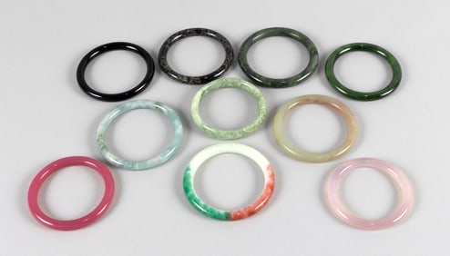 TEN CHINESE JADE AND HARDSTONE BANGLES 19th/20th Century Diameters approx 3".
