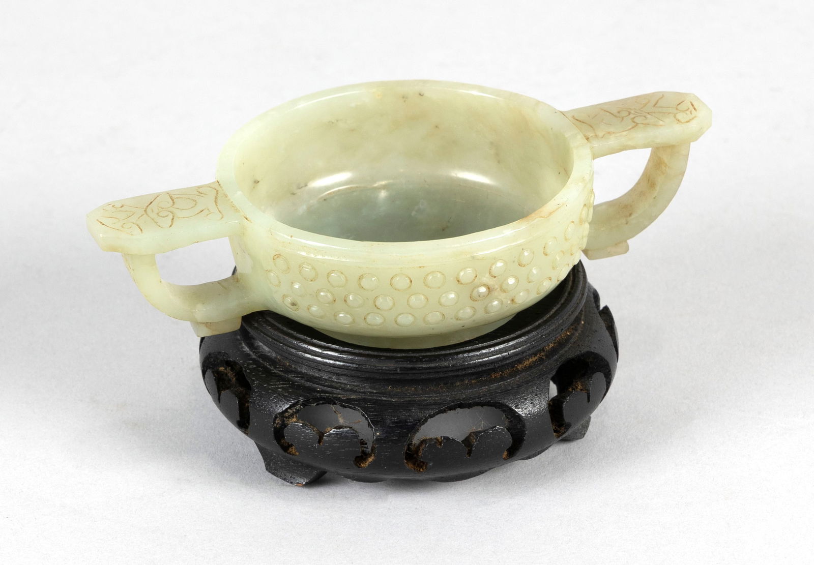 CHINESE ARCHAIC JADE TWO-HANDLED CUP Height 1". Width across handles 5". With wood stand. (1 of 7)