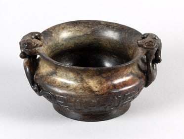 ARCHAIC MOTTLED GREEN AND BROWN JADE BOWL Height 3.5". Width across handles 6".