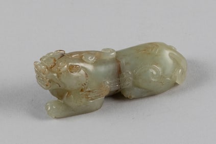 CHINESE PALE CELADON JADE FIGURE OF A RECLINING KYLIN 19th Century Length 3.5".
