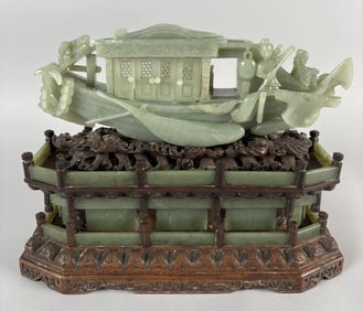 CHINESE PALE CELADON JADE CARVING OF A BOAT Late 19th Century Boat height 4". Length 12.5". Tiered