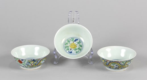 THREE CHINESE DOUCAI PORCELAIN DRAGON AND LOTUS WINE BOWLS Late 19th/Early 20th Century Heights