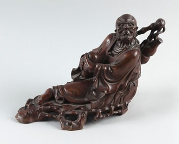 CHINESE CARVED ROOTWOOD FIGURE OF A SAGE 19th Century Height 9". Length 15".