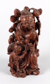 CHINESE CARVED BOXWOOD FIGURE GROUP OF SHOU LAO AND AN ATTENDANT Early 20th Century Height 9".