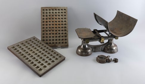 TWO METAL CANDY MOLDS AND A SCALE Early 20th Century Largest mold 17" x 11". Scale height 13".