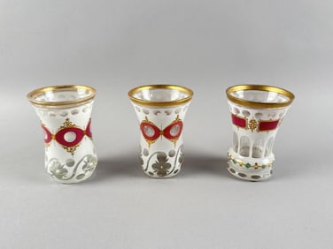 THREE BOHEMIAN CUT OVERLAY GLASS BEAKERS 19th Century Heights approx. 5".