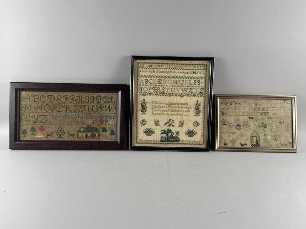 THREE NEEDLEWORK SAMPLERS 18th/19th Century Framed from 8.5" x 12" to 14" x 12".: THREE NEEDLEWORK SAMPLERS18th/19th CenturyDated 1789 (reproduction), 1835 and 1851. Each with rows of alphabets above traditional imagery. Largest (white background) wrought by Marianne Kindred and da
