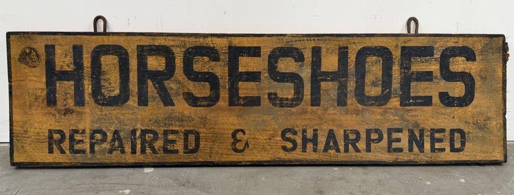 PAINTED WOODEN SIGN "HORSESHOES REPAIRED & SHARPENED" Contemporary 11" x 41".: PAINTED WOODEN SIGN "HORSESHOES REPAIRED & SHARPENED"ContemporaryBlack letters against a yellow ground.11" x 41".