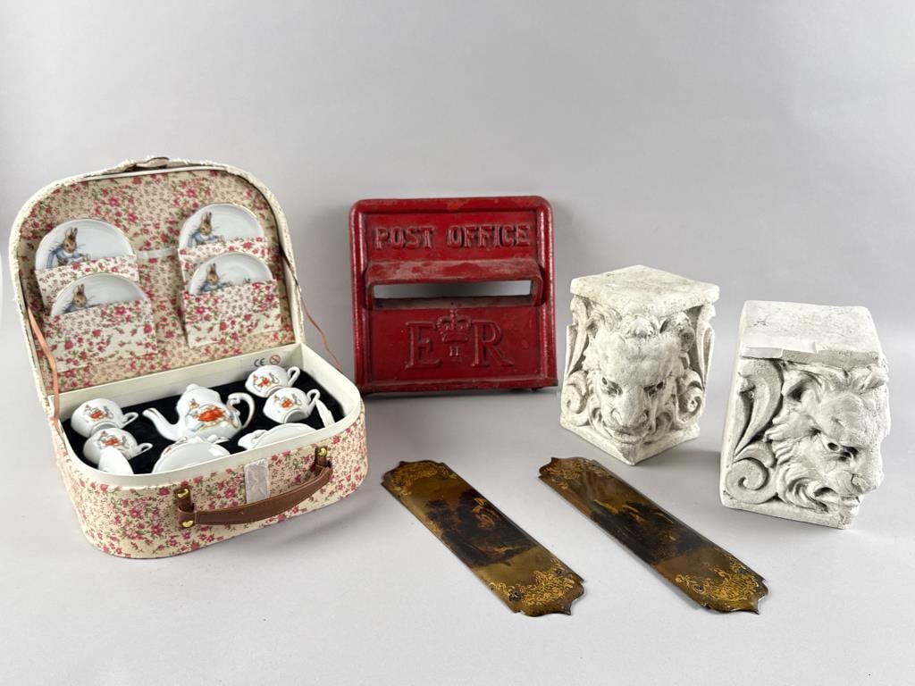 ODD LOT OF ENGLISH ITEMS: ODD LOT OF ENGLISH ITEMS1) Cast iron post office letter slot with Queen Elizabeth II royal cypher. Height 9.5". Width 10". Depth 3".2) Pair of classical lion's head plaster bookends. Heights 7.25". Wi