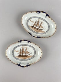 PAIR OF MOTTAHEDEH DISHES DEPICTING THE U.S.S. "CONSTITUTION" Heights 1.25". Lengths 7". Widths 5".