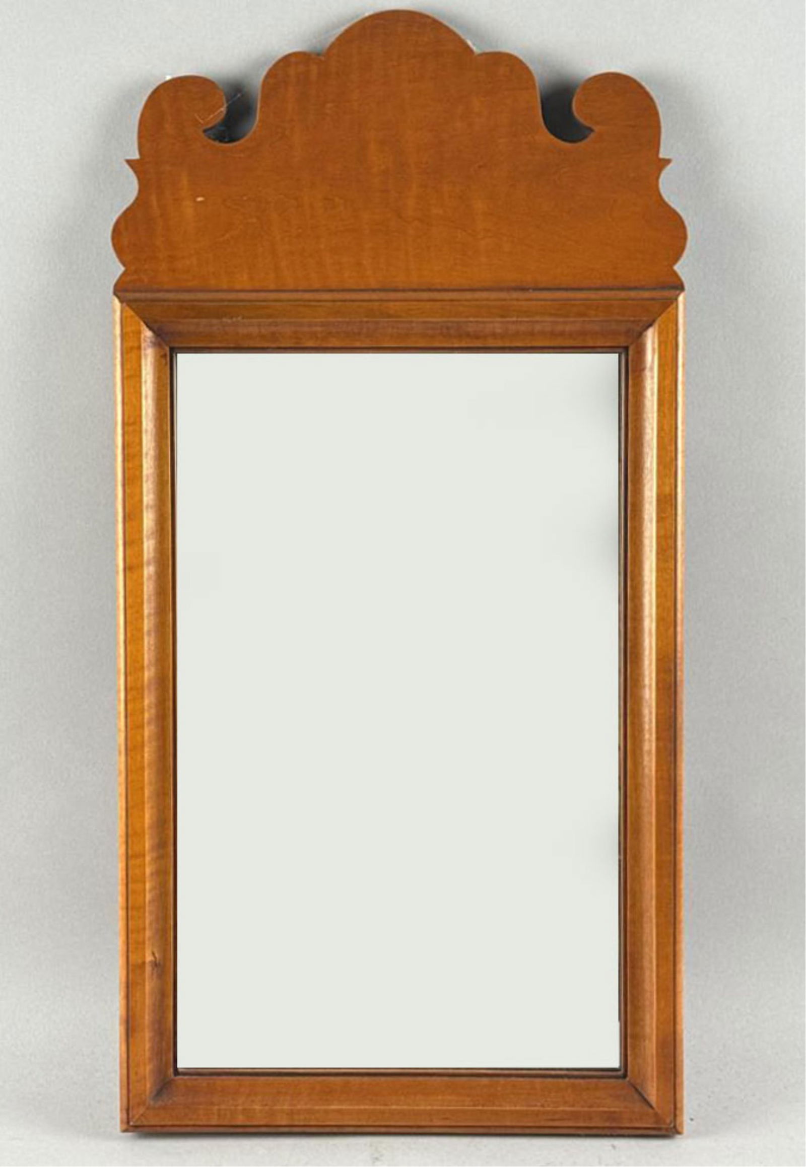 ELDRED WHEELER QUEEN ANNE-STYLE MIRROR Massachusetts, 20th Century Height 24". Width 12.25".: ELDRED WHEELER QUEEN ANNE-STYLE MIRRORMassachusetts, 20th CenturyWood frame. Paper label on reverse.Height 24". Width 12.25".