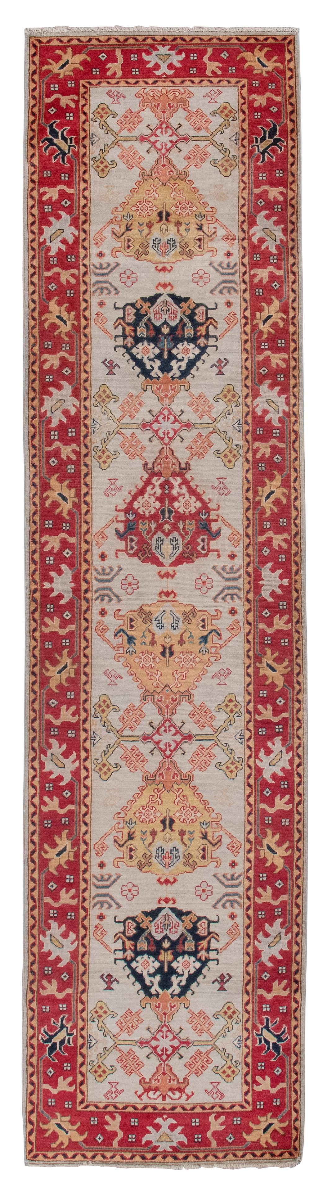 CAUCASIAN DESIGN RUG: 2'9" X 11'2" 21st Century: CAUCASIAN DESIGN RUG: 2'9" X 11'2"21st CenturyBold navy blue, yellow, wheat and rich red stylized elements alternate with stylized branches along the length of an ivory field. Narrow guard borders. Ri