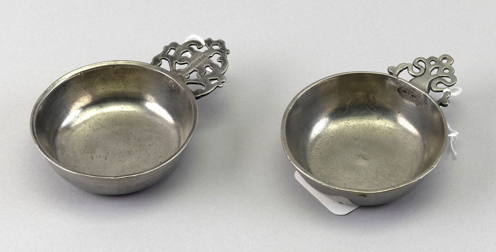 TWO AMERICAN PEWTER PORRINGERS Late 18th/Early 19th Century Lengths 5" and 5.25". (1 of 1)