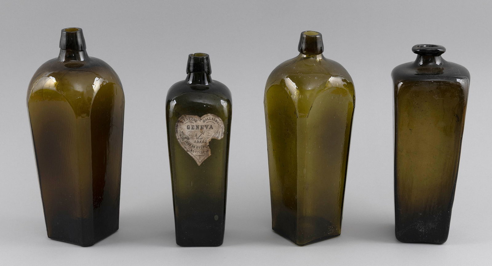 FOUR GREEN AND OLIVE GLASS GIN BOTTLES 19th Century Heights from 10" to 11". (1 of 2)