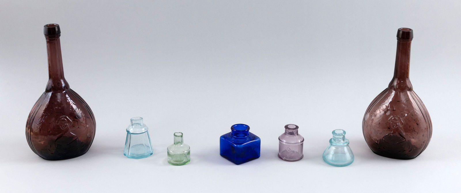 FIVE GLASS INKWELLS AND TWO REPRODUCTION BLOWN GLASS BOTTLES 19th Century Heights from 2.5" to 10". (1 of 2)