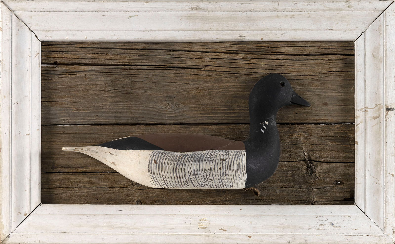 PAUL CASSON BRANT DECOY Massachusetts, 20th Century Decoy height 7". Length 16". Framed 16" x 25". (1 of 2)