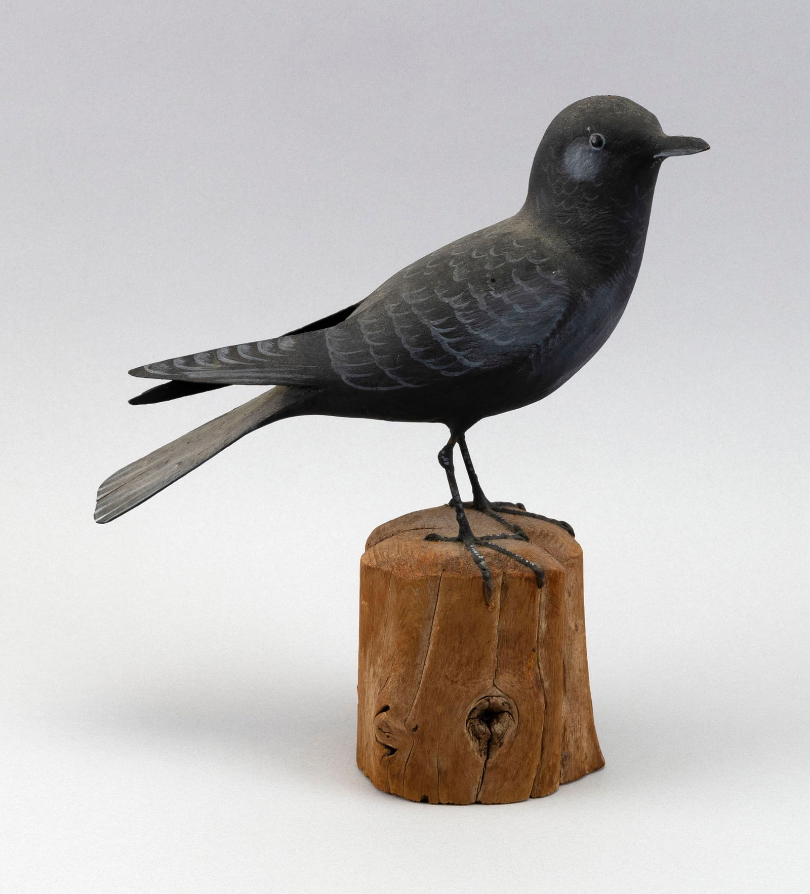 PETER PELTZ DECORATIVE CROW East Sandwich, Massachusetts, 1915-2001 Height 11".: PETER PELTZ DECORATIVE CROWEast Sandwich, Massachusetts, 1915-2001Mounted on a driftwood base. Signed on underside.Height 11".