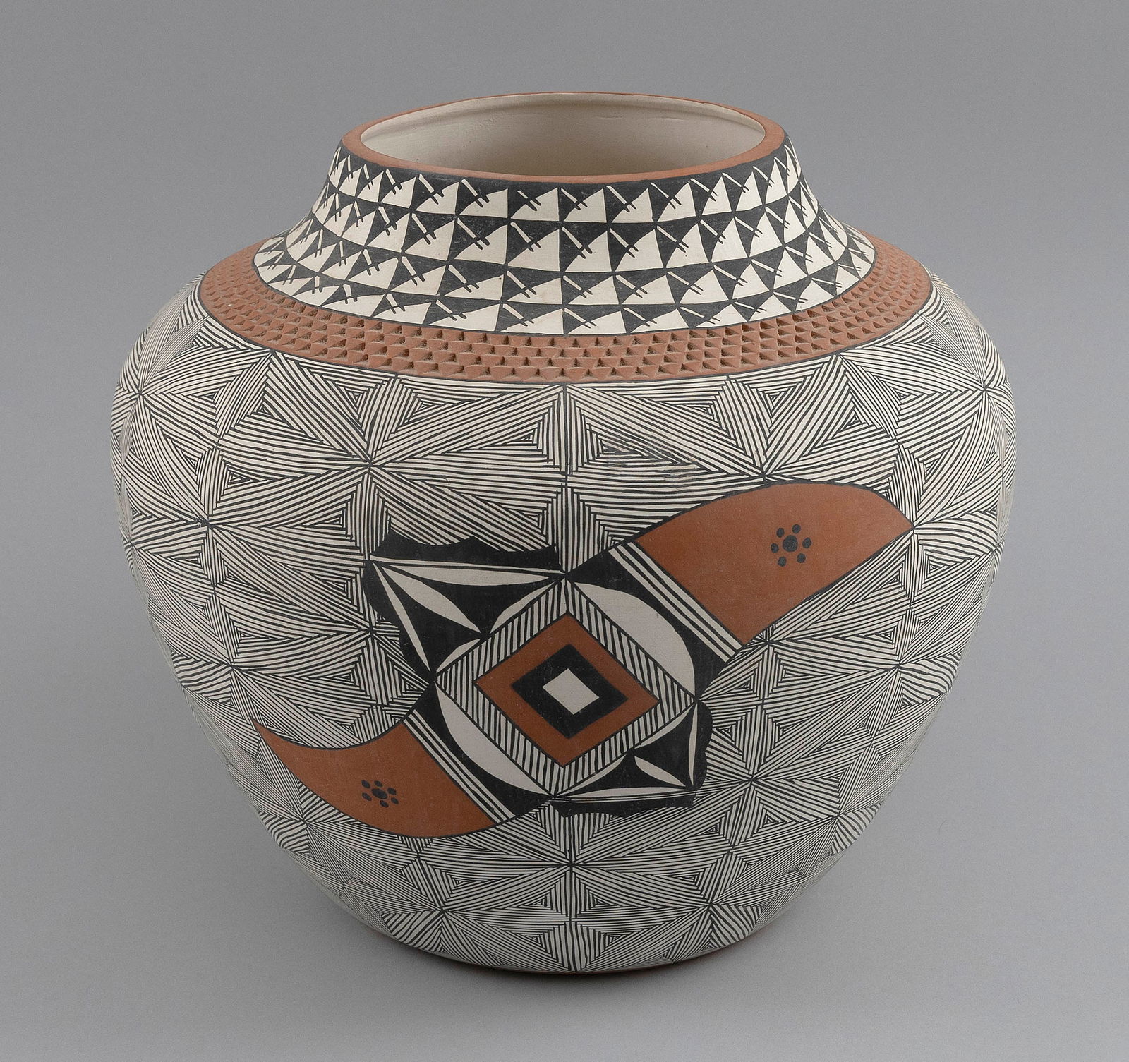ACOMA POTTERY JAR 20th Century Height 11".: ACOMA POTTERY JAR20th CenturyHand-painted geometric designs.Height 11".