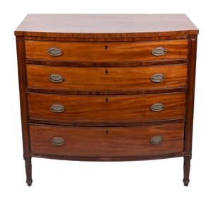 SHERATON BOWFRONT MAHOGANY AND MAHOGANY VENEER CHEST Circa 1815 Height 40". Width 42". Depth 23.5".