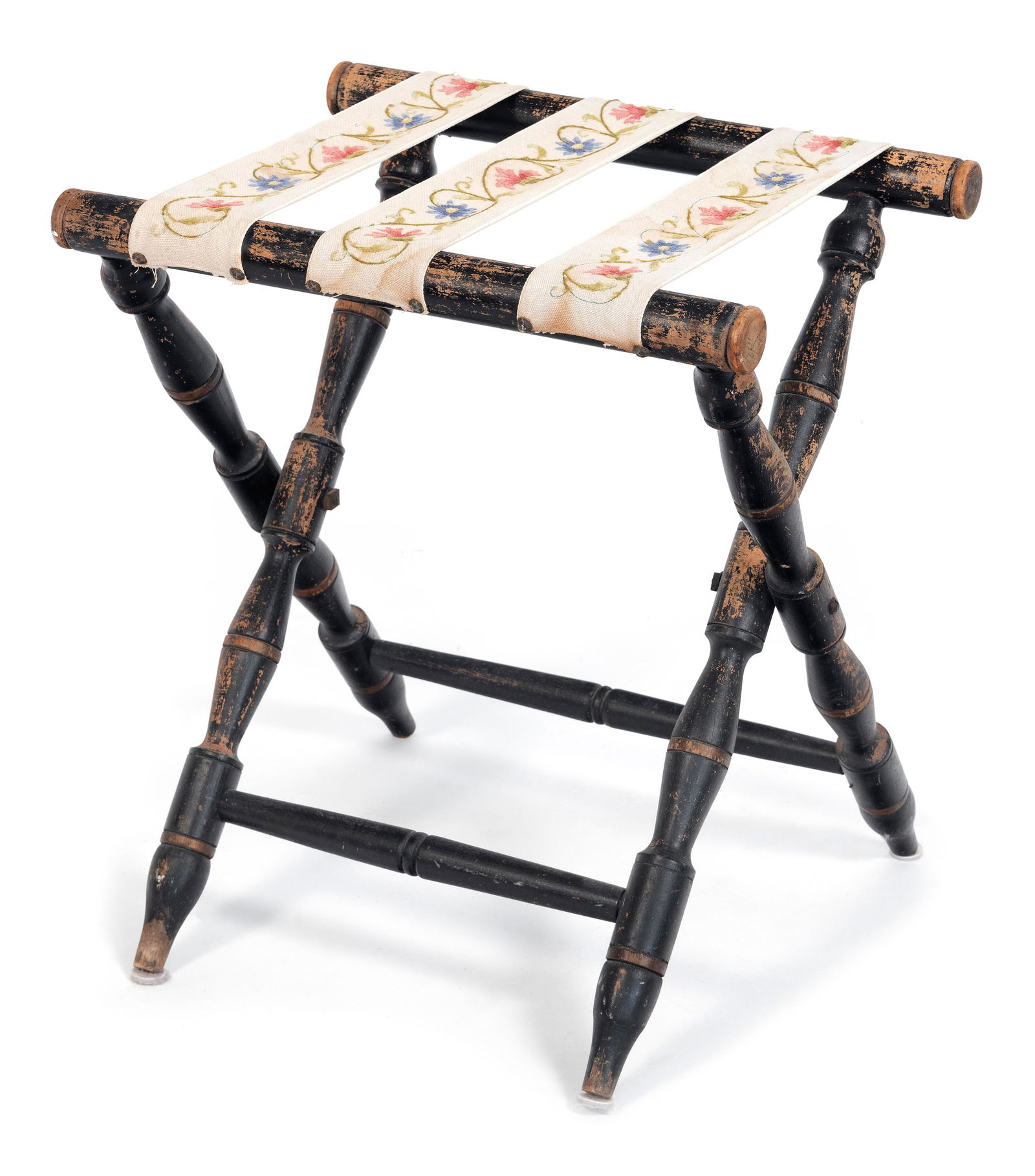 RARE AND UNUSUAL ANTIQUE FOLDING LUGGAGE RACK Last Half of the 19th Century Height 23.5". Top open: RARE AND UNUSUAL ANTIQUE FOLDING LUGGAGE RACKLast Half of the 19th CenturyStraps with colorful floral needlework design. Turned wooden frame painted black.Height 23.5". Top open 21" x 17". Provenance: