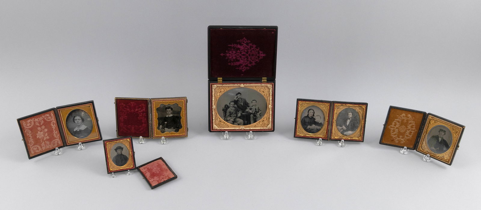 COLLECTION OF CASED DAGUERREOTYPES, AMBROTYPES AND TINTYPES 19th Century Cases from 4" x 3" to 5" x: COLLECTION OF CASED DAGUERREOTYPES, AMBROTYPES AND TINTYPES19th CenturyTotal of seven. Includes one of a woman, one of a boy, one of a uniformed man with a gold watch, and one of a young man, possibly