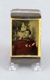 CELLULOID ADVERTISING MATCH SAFE DEPICTING A FIREMAN Early 20th Century Length 2.75".