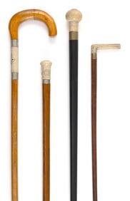THREE CANES AND A RIDING CROP Late 19th Century Lengths from 26.5" to 34.5".