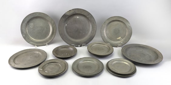 NINETEEN PEWTER PLATES AND CHARGERS 18th-20th Century Diameters from 8" to 16.75".