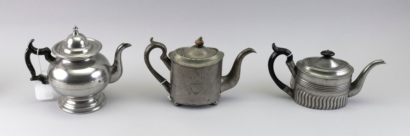 THREE PEWTER TEAPOTS First Half of the 19th Century Heights from 5.5" to 8". (1 of 2)