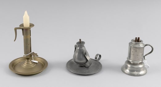 TWO PEWTER LAMPS AND AN ADJUSTABLE BRASS CANDLESTICK England and America, 19th Century Heights from