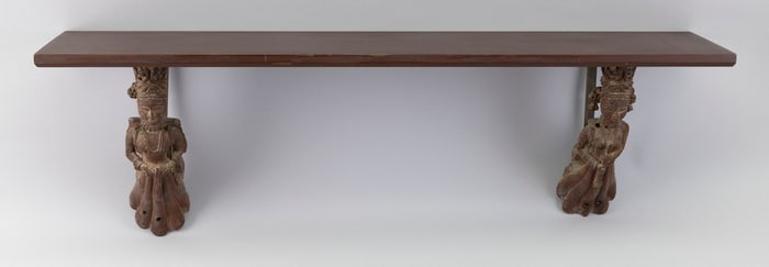 RED PAINTED SHELF WITH SOUTHEAST ASIAN-STYLE FIGURAL SUPPORTS 20th Century Length 32".