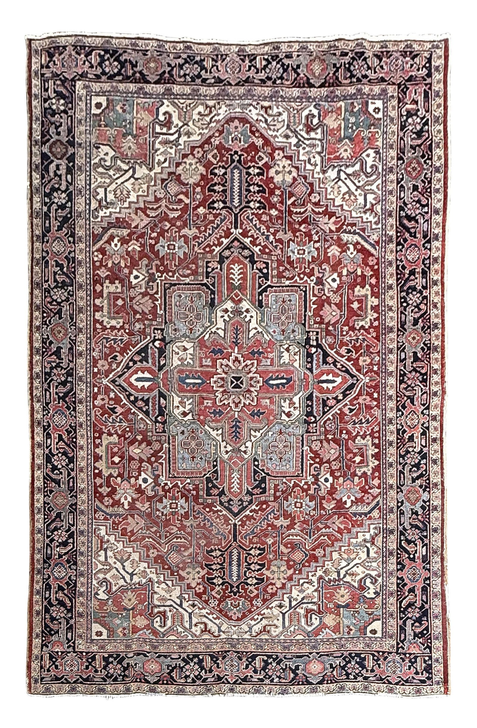 HERIZ RUG: 8'3" X 10'11" Early 20th Century: HERIZ RUG: 8'3" X 10'11"Early 20th CenturyRich red field with blossoming vines and central medallion. Ivory and navy blue borders with salmon and sky blue blossoms.