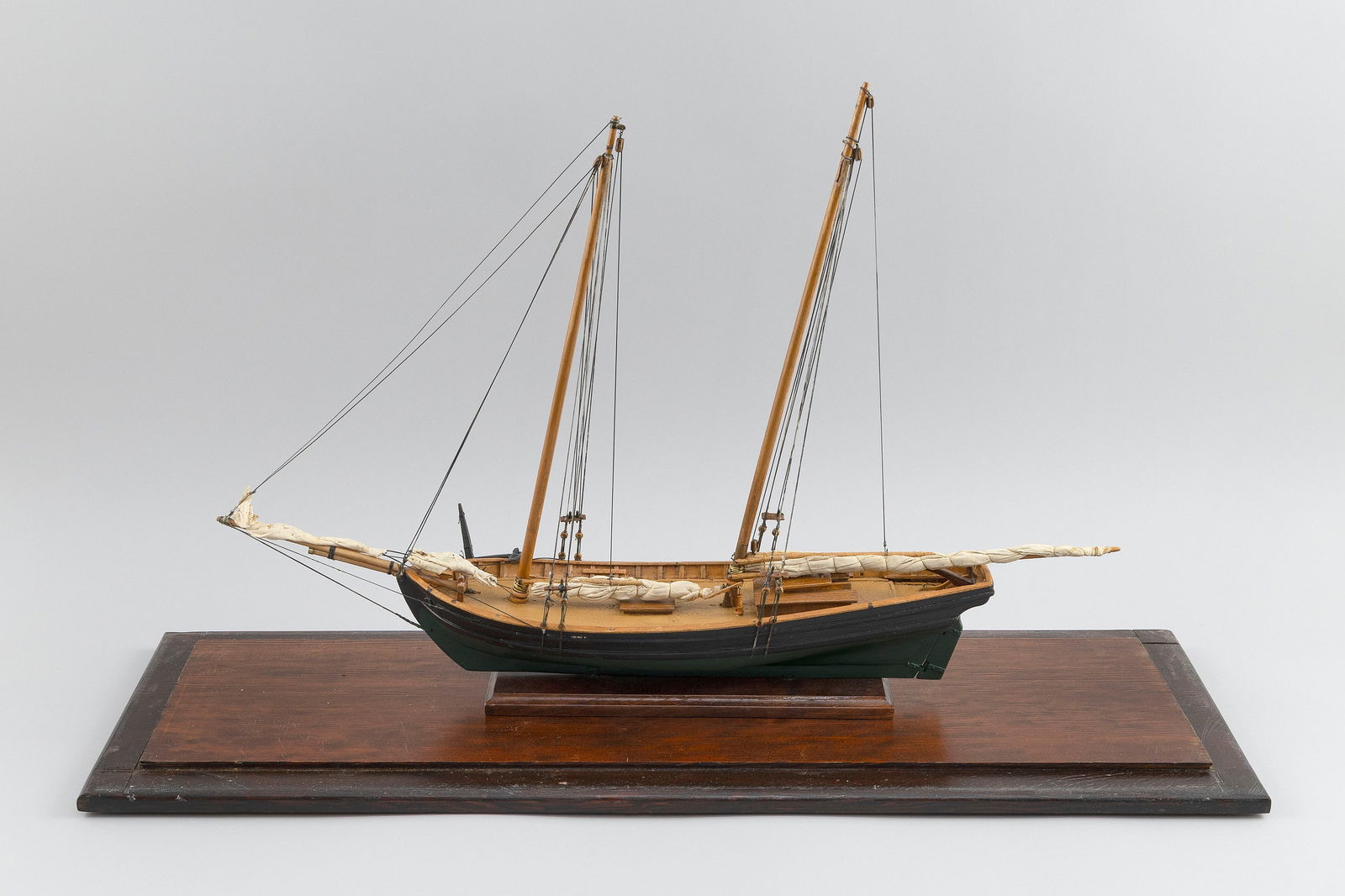 CASED MODEL OF A TWO-MASTED SAILING VESSEL 20th Century Case height 20". Length 30". Width 10". (1 of 3)