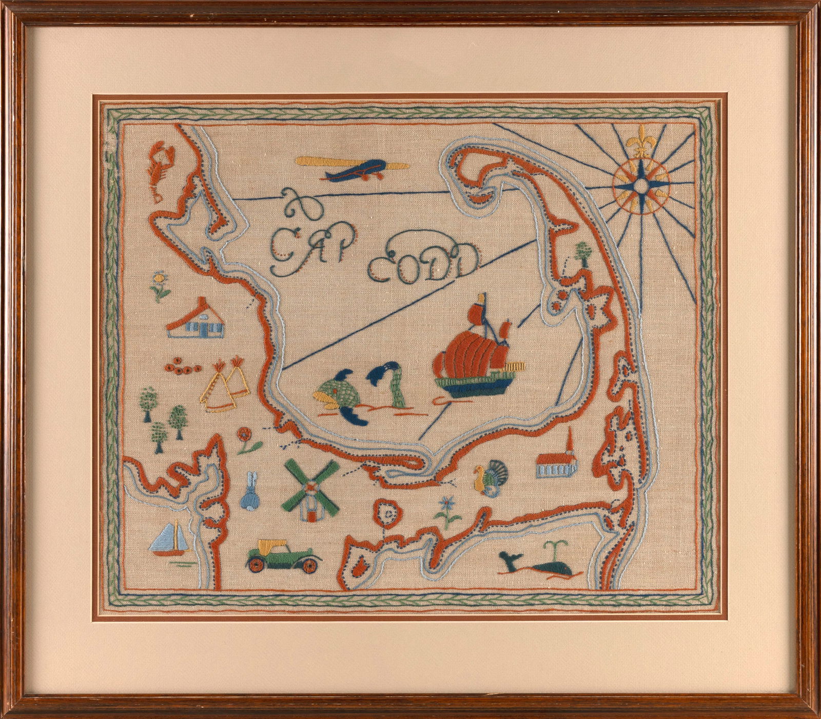 "CAP CODD" PICTORIAL NEEDLEWORK 20th Century Framed 18" x 22".: "CAP CODD" PICTORIAL NEEDLEWORK20th CenturyDepicts landmarks, a compass rose and other icons in and around an outline of Cape Cod.Framed 18" x 22".