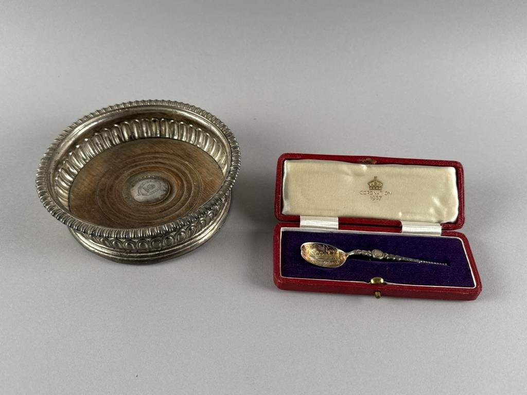 TWO PIECES OF ENGLISH STERLING SILVER 19th and 20th Century: TWO PIECES OF ENGLISH STERLING SILVER 19th and 20th Century 1) Wine bottle coaster with mahogany base inset with a silver medallion bearing a familial engraving and motto "Gang Forward". Maker's mark