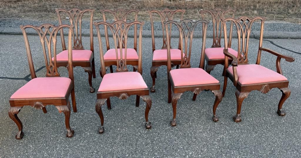 SET OF EIGHT CHIPPENDALE-STYLE MAHOGANY CHAIRS 20th Century Back heights 41". Seat heights 19".: SET OF EIGHT CHIPPENDALE-STYLE MAHOGANY CHAIRS20th CenturySeven side chairs and one armchair. Pierced and carved backs. Upholstered slip seats. Acanthus-carved legs end in claw & ball feet.Back height